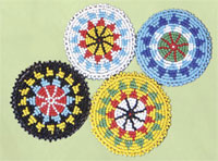 Rosettes, beaded 2.25 inch red,yellow,white,black,turquoise